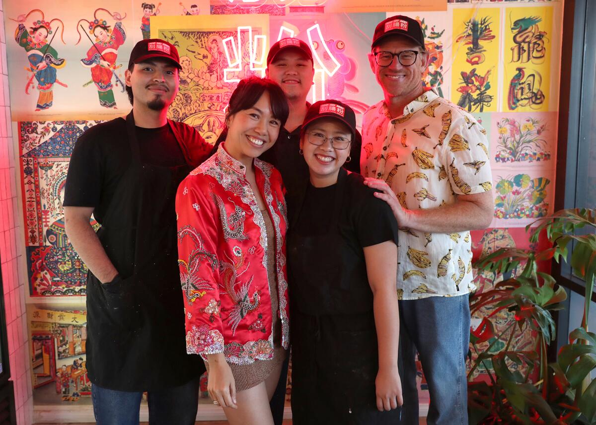 Co-founder and chef Jo Situ-Allen with staff at Mo Mi Mei restaurant in Costa Mesa.