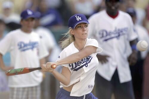 Kendra Wilkinson keeps her eye on the ball and delivers a hit Saturday afternoon during the Hollywood Stars softball game at Dodger Stadium.