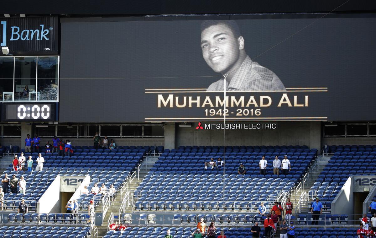 Fans stand for a moment of silence in memory of boxer Muhammad Ali, Saturday, June 4, 2016 before a Copa America Centenario soccer match.