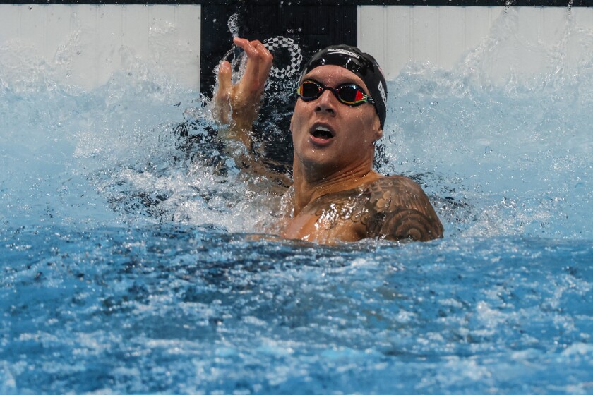 U.S. Caeleb Dressel looks up at the timing screen immediately after winning the men's 100-meter freestyle on Thursday.