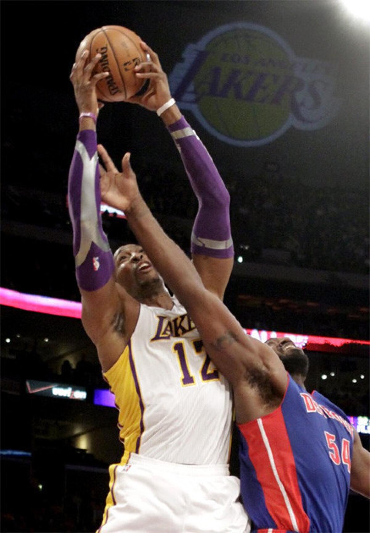 Dwight Howard skies over Detroit's Jason Maxiell for a rebound during the recent Lakers-Pistons game at Staples Center.