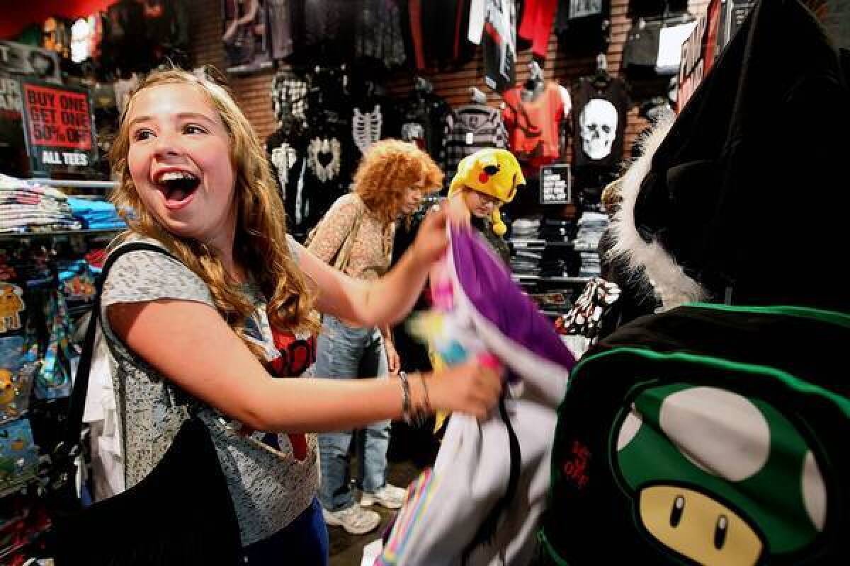 A super-excited Kaylee Vega, 13, spots a unicorn backpack inside Hot Topic at the South Bay Galleria in Redondo Beach.