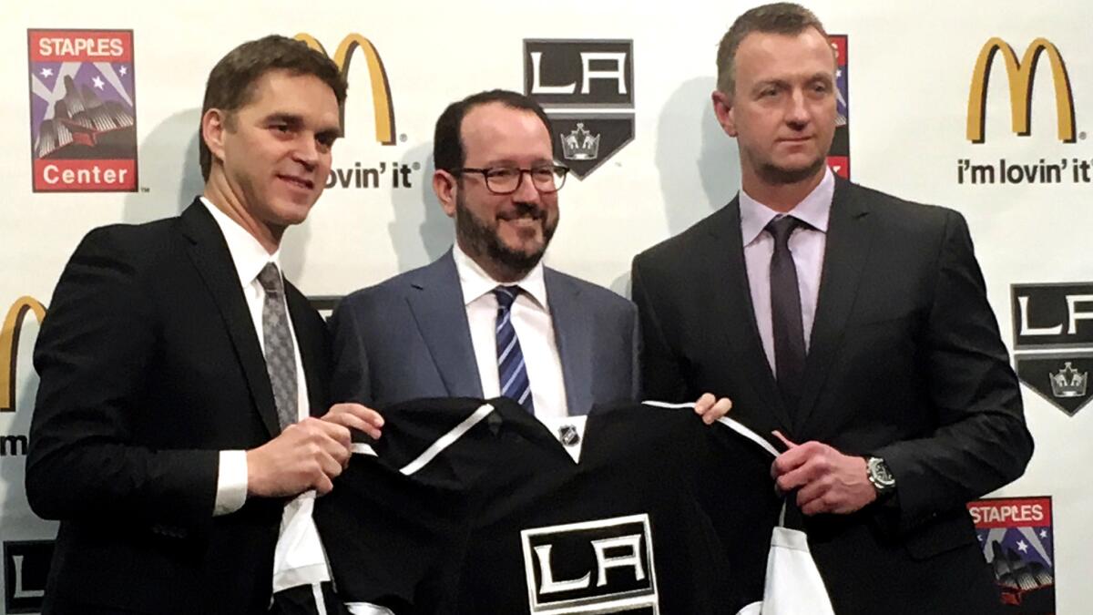 Luc Robitaille, left, and Rob Blake flank AEG executive Dan Beckerman during a news conference in April to announce promotions for Robitaille and Blake.