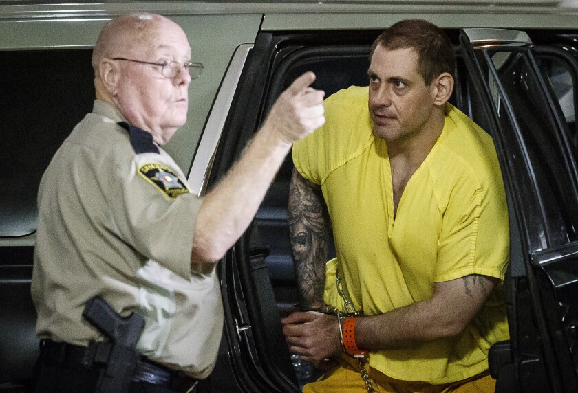 Escaped inmate Casey White, right, arrives at the Lauderdale County Courthouse in Florence, Ala., after waiving extradition in Indiana Tuesday, May 10, 2022. (Dan Busey/The TimesDaily via AP)