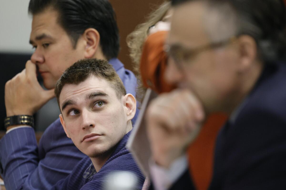 FILE Marjory Stoneman Douglas High School shooter Nikolas Cruz sits at the defense table during jury selection in the penalty phase of his trial at the Broward County Courthouse in Fort Lauderdale, Fla., on Wednesday, June 29, 2022. The judge has refused to delay the sentencing trial of Cruz in the 2018 shooting at a high school in which 17 people were killed. (Amy Beth Bennett/South Florida Sun-Sentinel via AP, Pool)