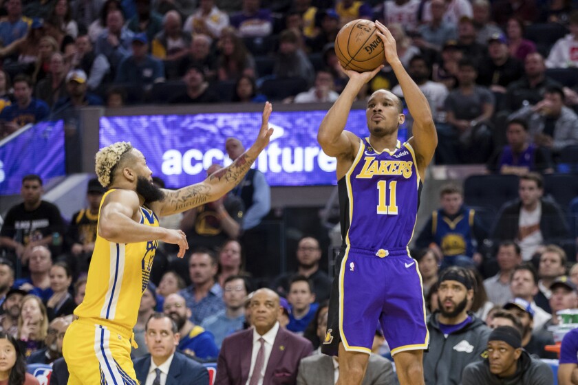 Lakers guard Avery Bradley shoots a jumper against Warriors guard Ky Bowman during a game Feb. 8, 2020, in San Francisco.