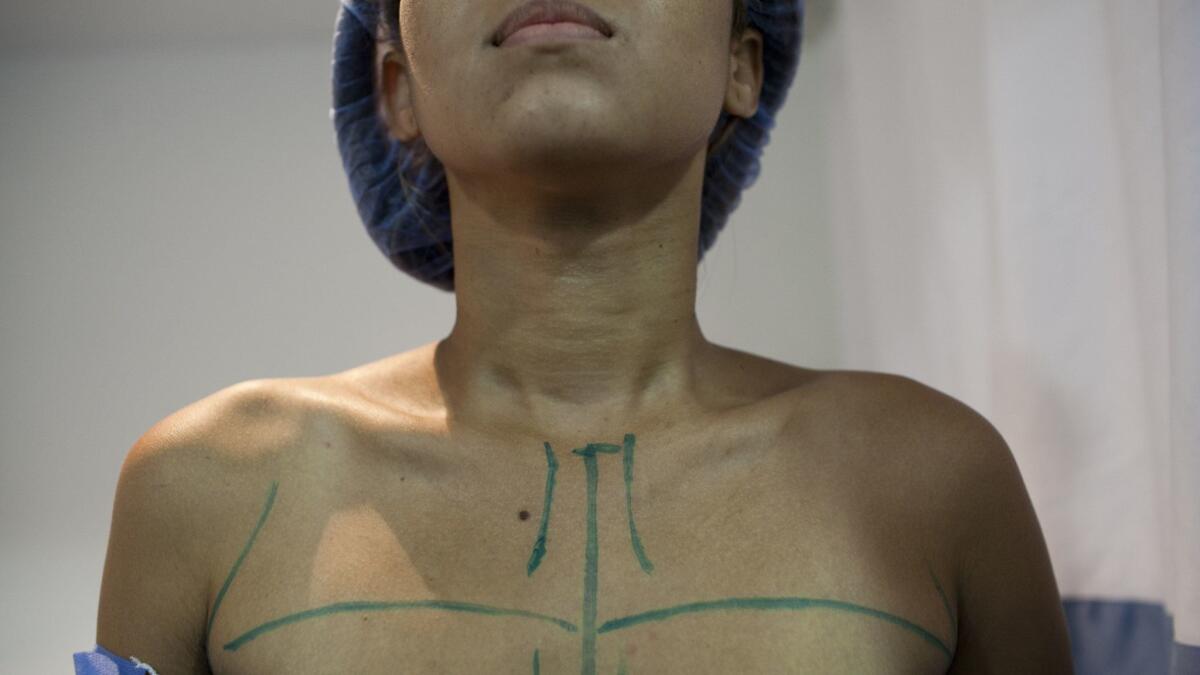 A patient is prepped for breast surgery in Caracas, Venezuela on Sept, 4, 2014.