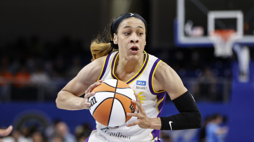 Los Angeles Sparks guard Chennedy Carter looks to pass the ball against the Chicago Sky