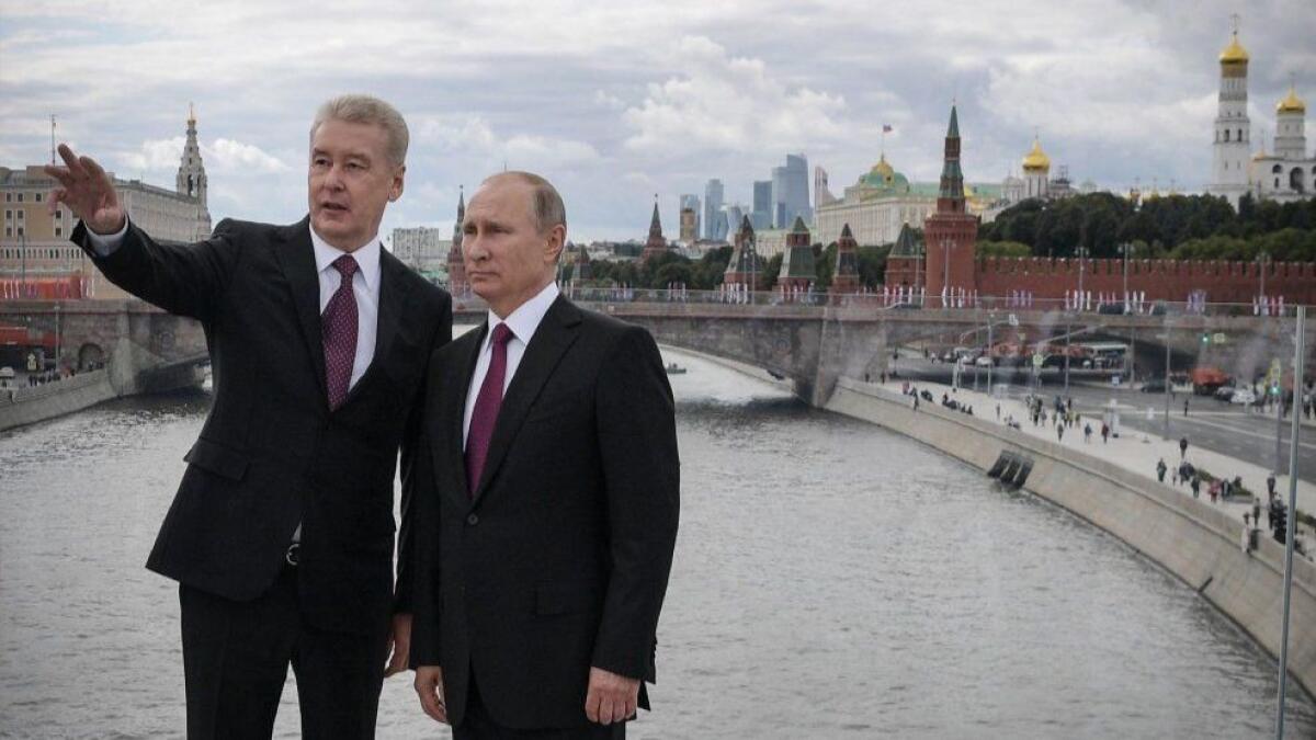 Russian President Vladimir Putin, right, and Moscow Mayor Sergei Sobyanin at Zaryadye Park in Moscow in 2017. Anger over planned pension reforms threaten turnout for Sunday's election, in which the Kremlin-backed Sobyanin is seeking reelection.