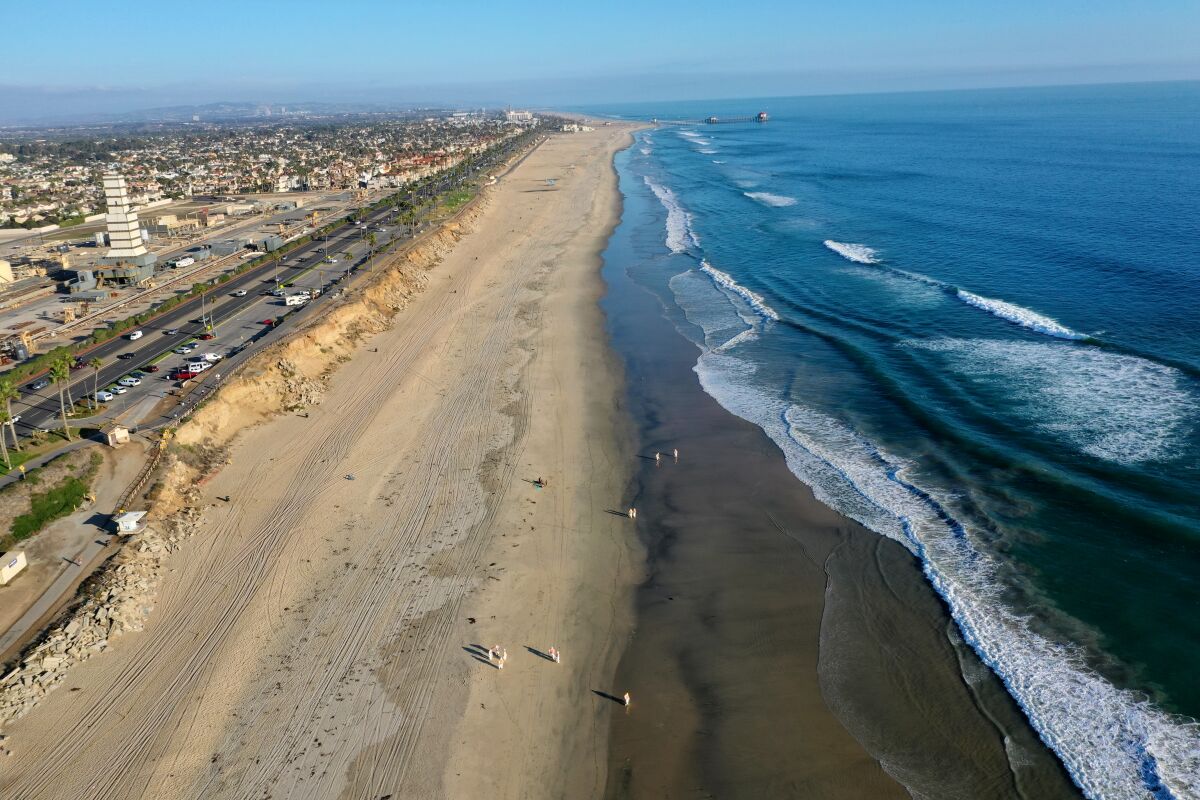 An aerial view of cleanup crews working in Huntington Beach on Oct. 5 after an oil spill off the coast. 