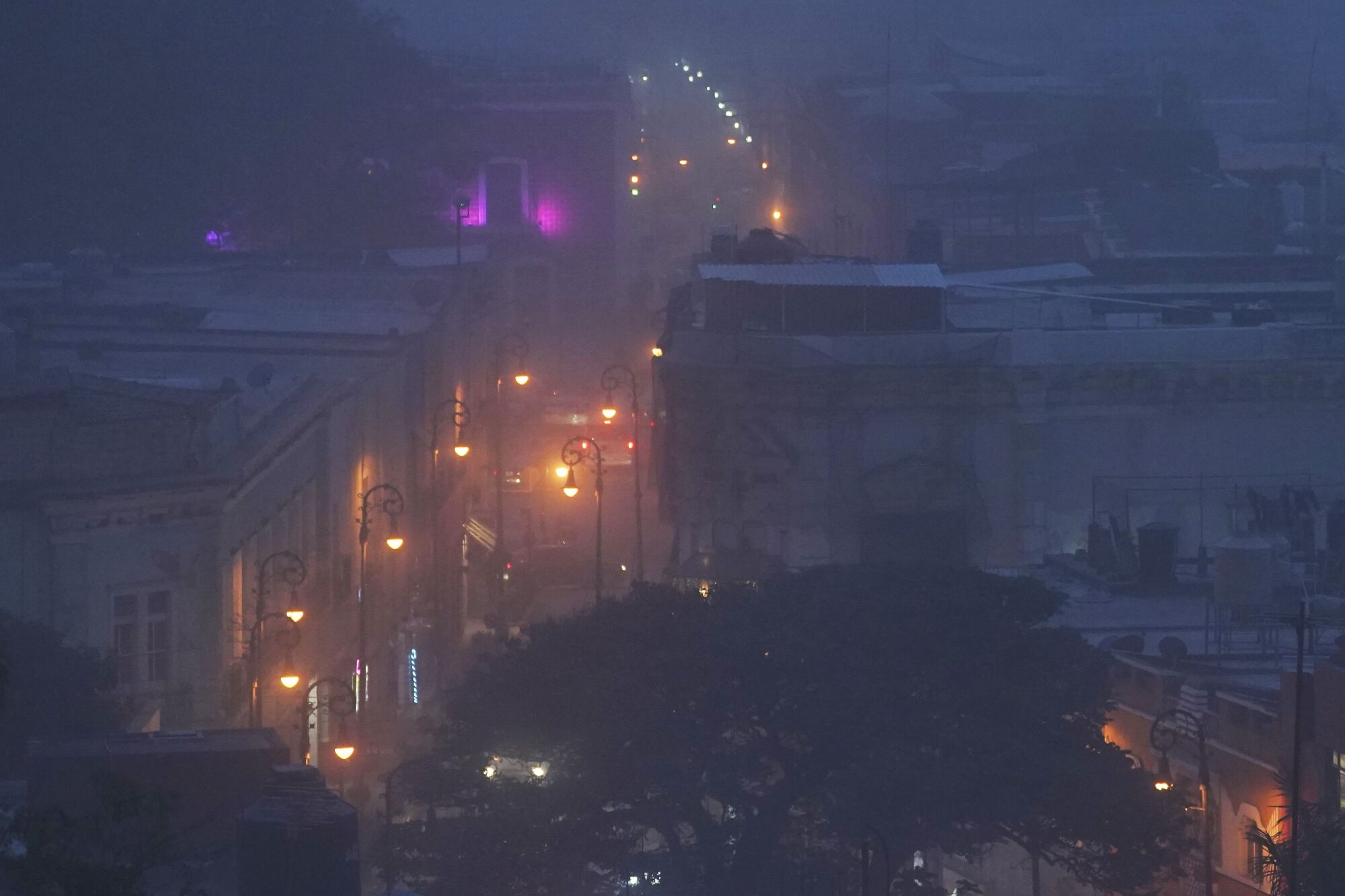 A hazy view of lighted buildings 
