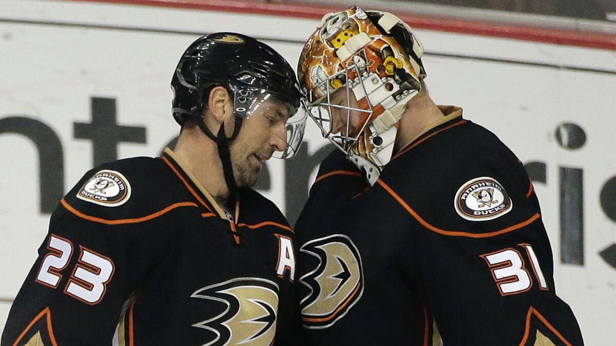 Ducks goalie Frederik Andersen, right, and defenseman Francois Beauchemin celebrate a 3-0 win over the St. Louis Blues on Sunday.
