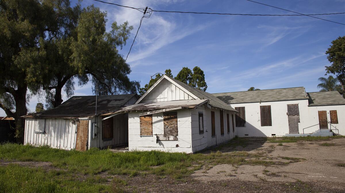 Historic Wintersburg buildings in Huntington Beach are among the sites that Preserve Orange County is working to protect. From left are the Japanese Presbyterian manse, or parsonage; the mission; and the church.