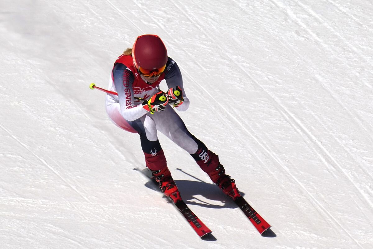 Mikaela Shiffrin, of the United States speeds down the course during women's downhill training at the 2022 Winter Olympics, Monday, Feb. 14, 2022, in the Yanqing district of Beijing. (AP Photo/Robert F. Bukaty)