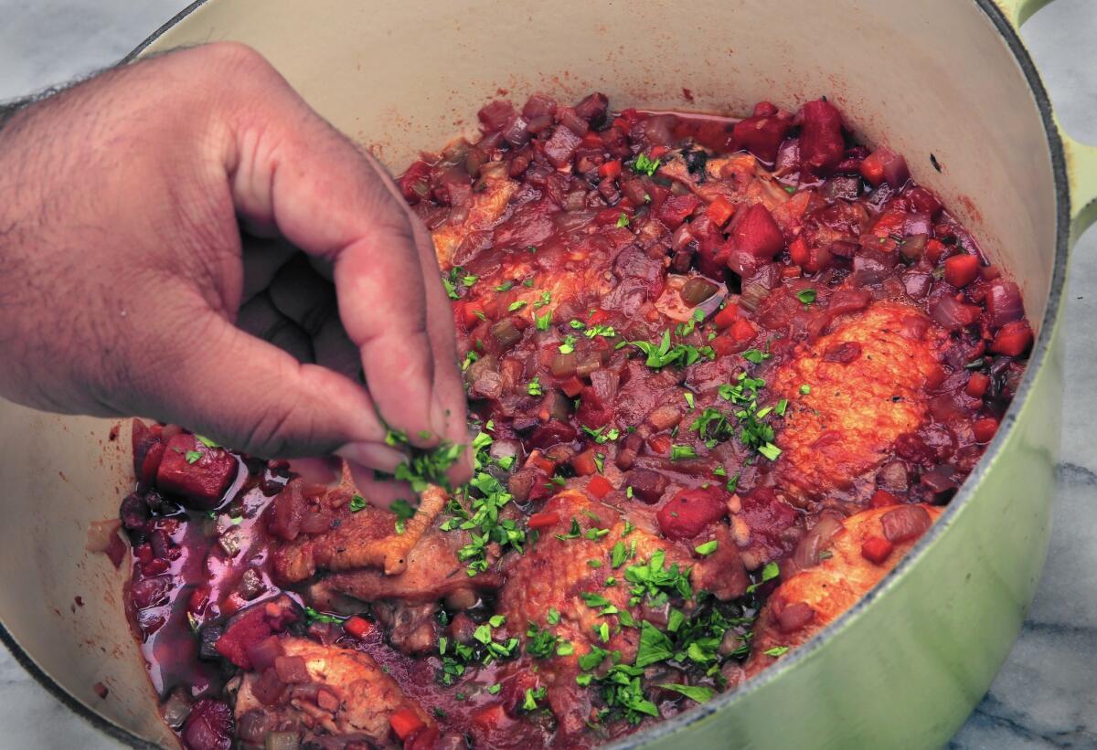 Chicken braised with pancetta and tomatoes.