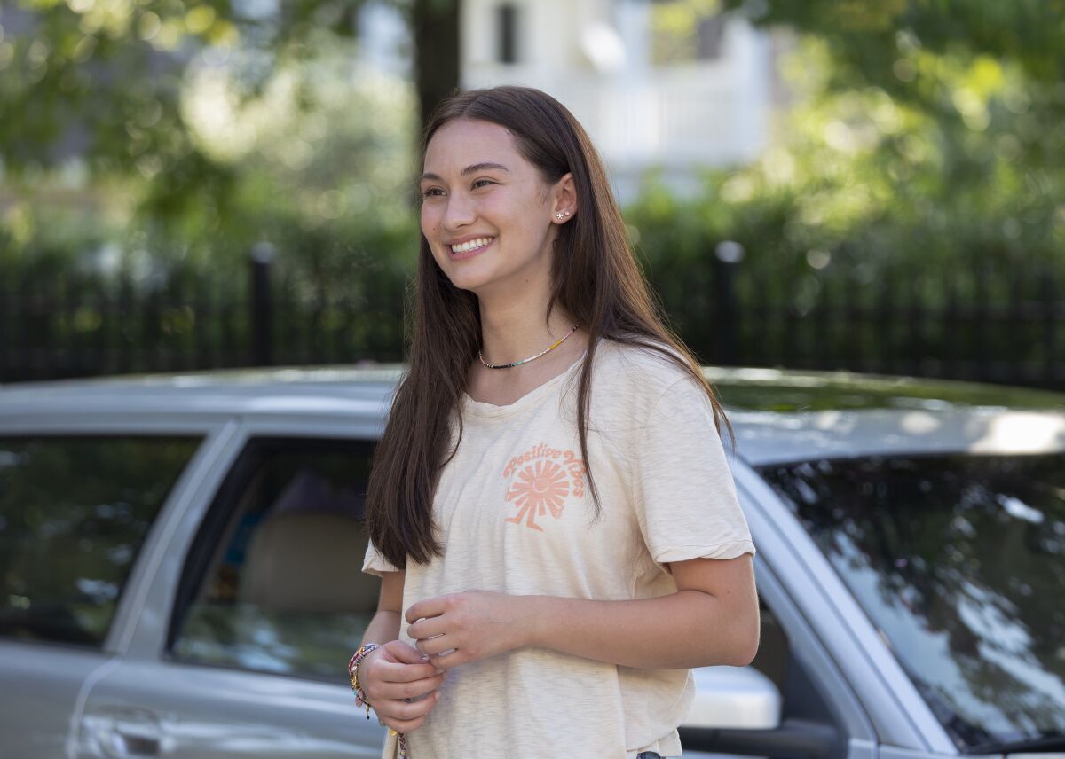 This image released by Amazon Prime Video shows Lola Tung in a scene from the series "The Summer I Turned Pretty." (Dana Hawley/Amazon Prime Video via AP)