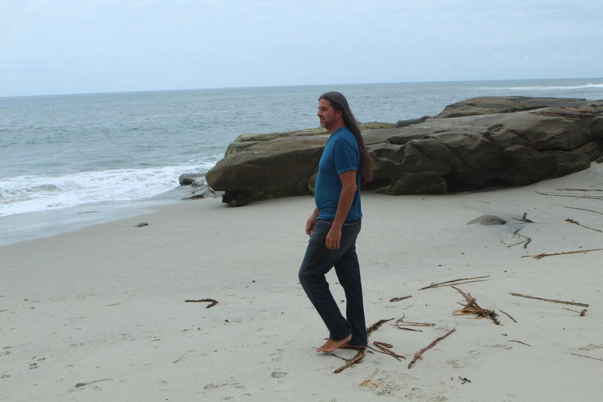 Adam Raby takes his daily head-clearing walk at Windansea Beach.