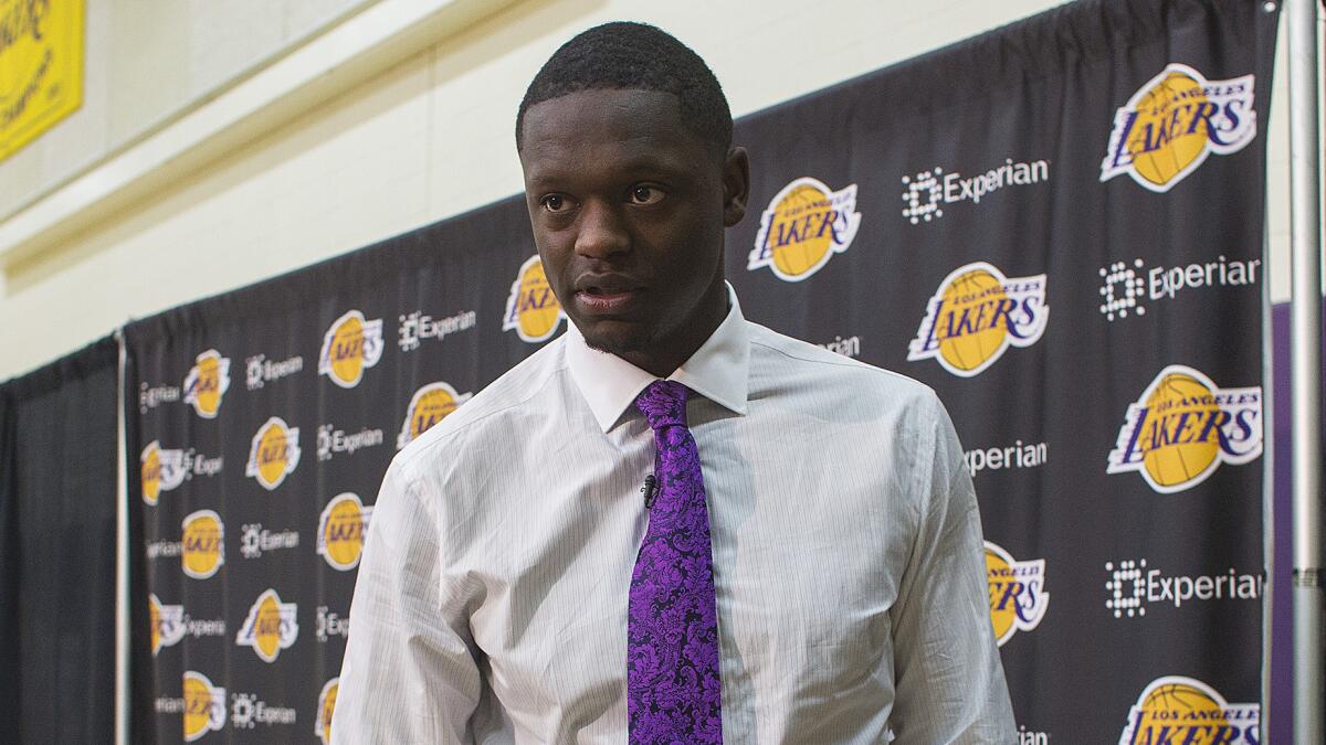 Julius Randle won't be able to play on the Lakers' summer league team until the team signs him. The Lakers are delaying his signing in an effort to free up money to sign free agents.