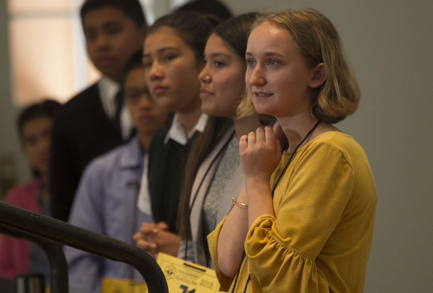 Camille Wetherell, right, from San Marcos Middle school was the next speller in line at the 49th annual San Diego Union-Tribune county wide spelling bee held at Liberty Station.