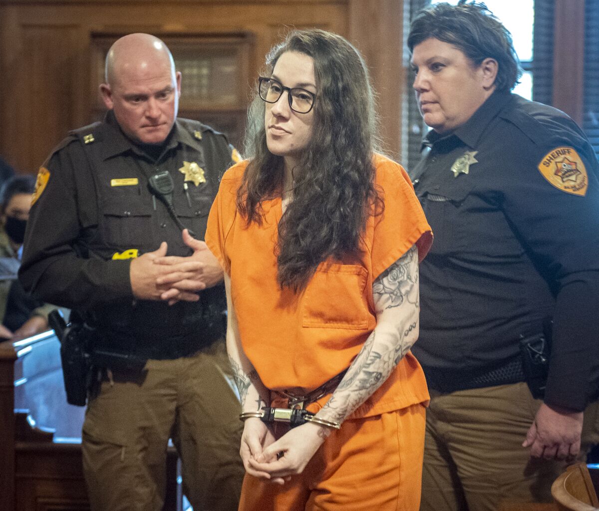 Bailey Boswell walks out of the courtroom after being sentenced to life in prison without parole for the 2017 murder of Sydney Loofe, Monday, Nov. 8, 2021, in Wilber, Neb. (Justin Wan/Lincoln Journal Star via AP)