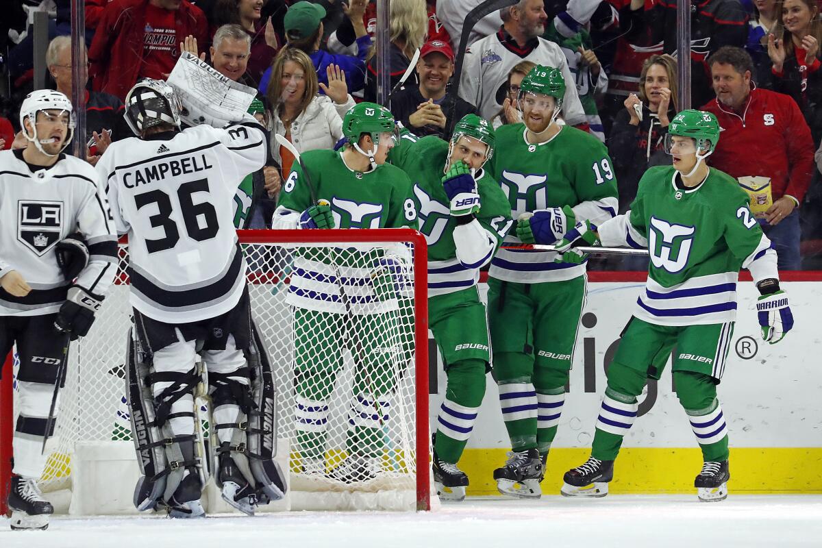 Hurricanes right wing Nino Niederreiter (21) celebrates with his teammates after scoring a goal against the Kings during the first period of a game Jan. 11 at PNC Arena.