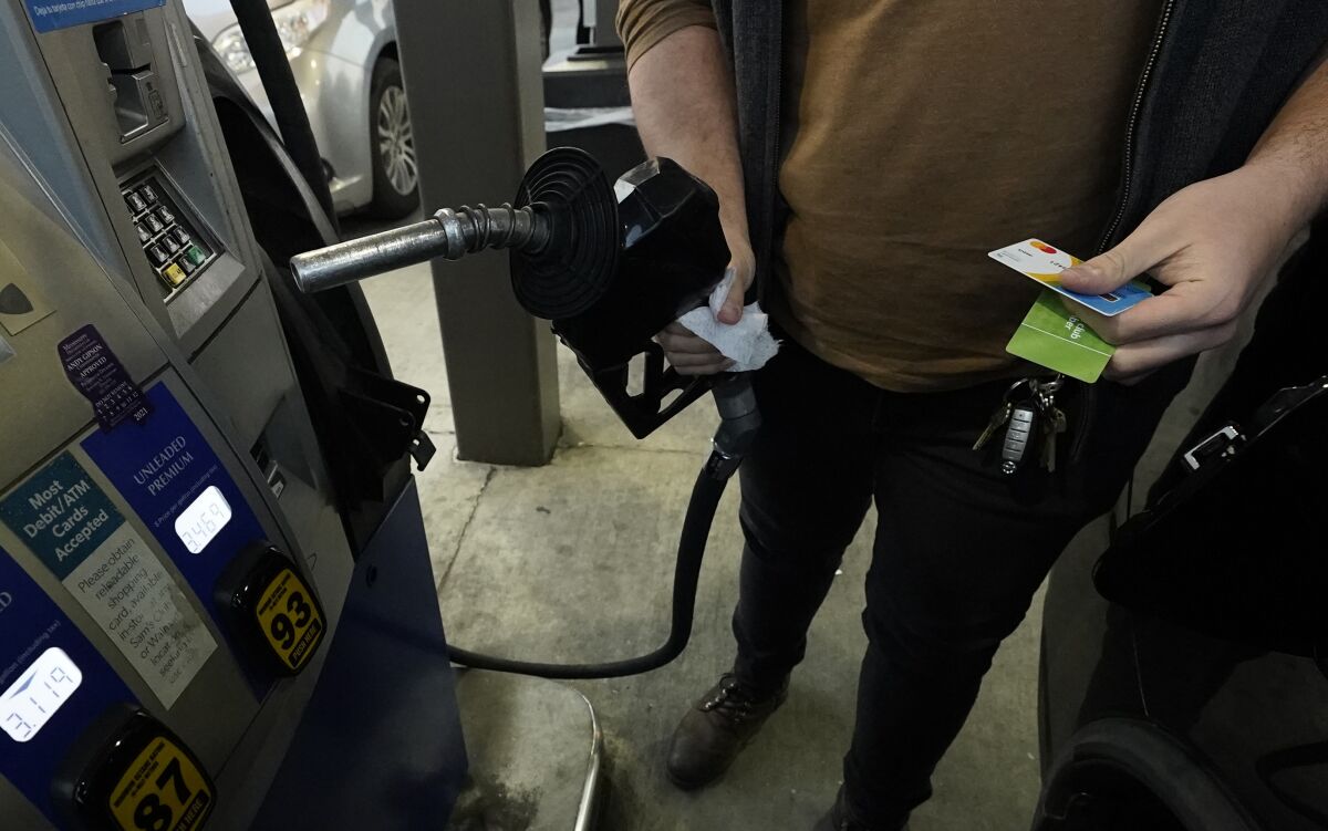 A customer prepares to pump gasoline into his car at a Sam's Club fuel island in Gulfport, Miss., Feb. 19, 2022. The Russia-Ukraine crisis is helping to raise oil and gasoline prices to high levels. Gasoline prices are setting a new record, and they're likely to go higher in the coming weeks. The national average topped $4.17 a gallon on Tuesday, March 8 according to auto club AAA. Californians already pay over $5 on average, and residents in a few other states could soon join them. (AP Photo/Rogelio V. Solis)