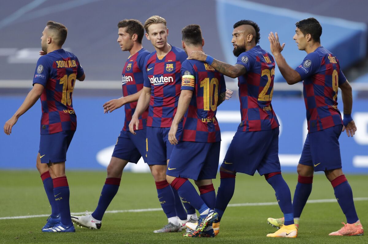 Players of Barcelona celebrate their first goal against Bayern Munich in the Champions League quarterfinals.