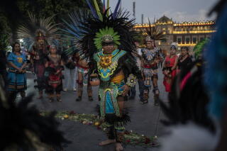 Dancers in colorful costumes perform