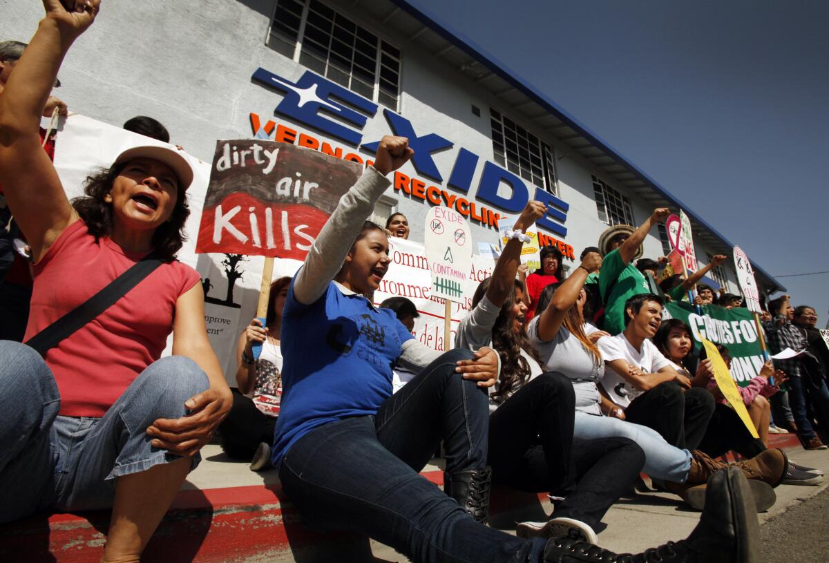 Members of environmental groups rally outside the Exide Technologies battery recycling smelter in Vernon demanding cleanup of the plant in April.