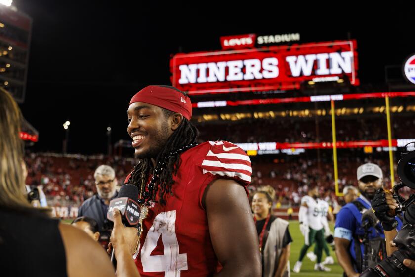 SANTA CLARA, CA - SEPTEMBER 9: Running back Jordan Mason #24 of the San Francisco 49ers talks with an ESPN reporter after an NFL football game against the New York Jets, at Levi's Stadium on September 9, 2024 in Santa Clara, California. (Photo by Brooke Sutton/Getty Images)