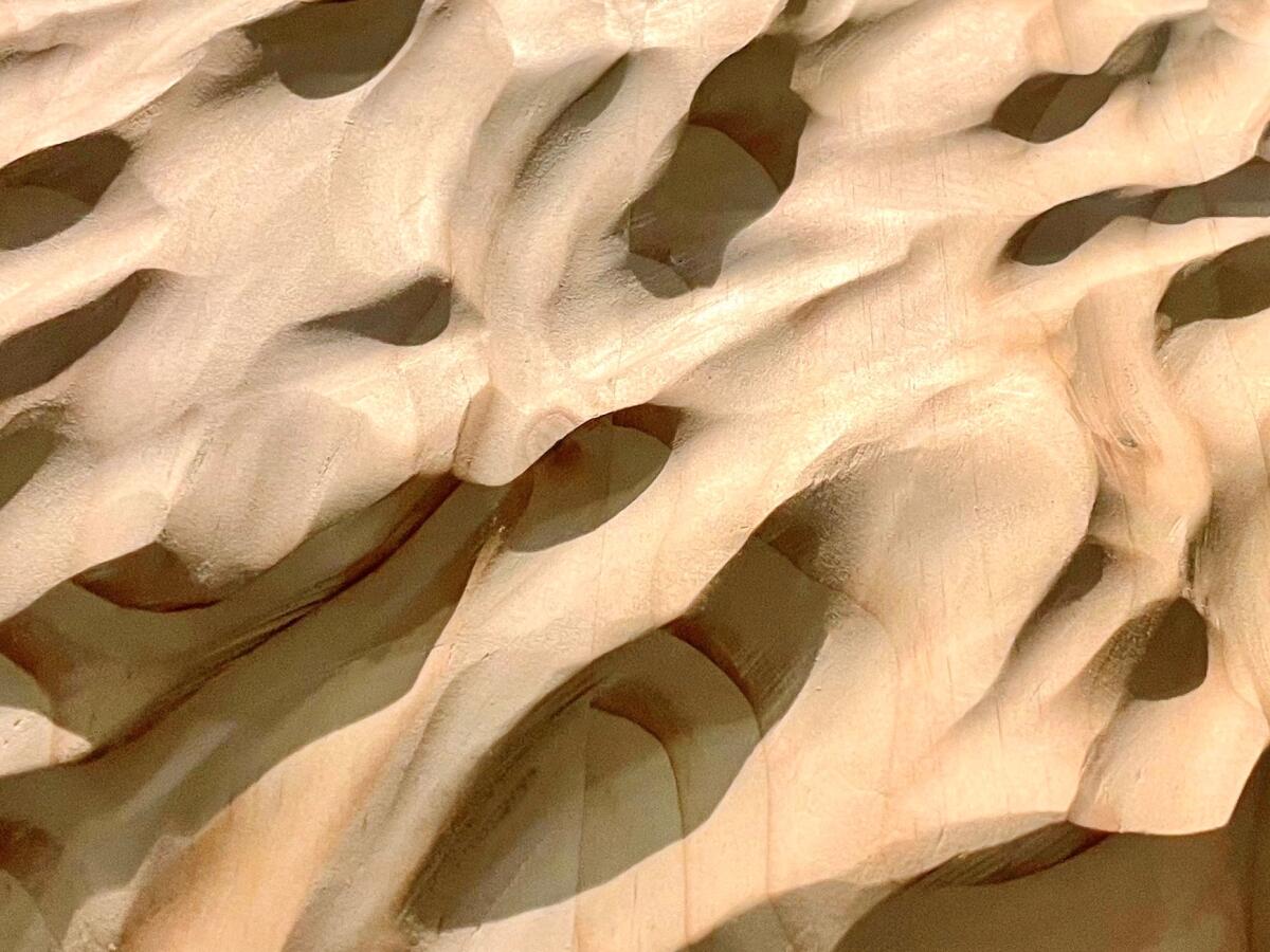 A rendering of a woodlike surface with indentations.