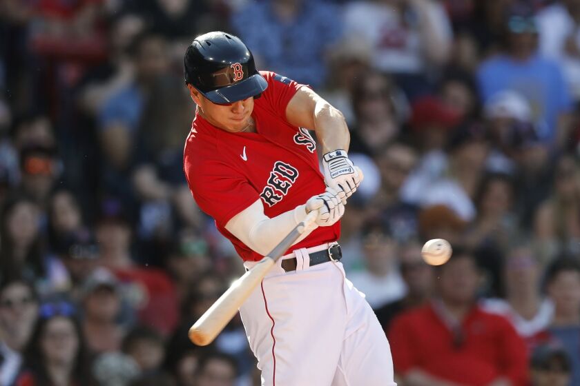 Boston Red Sox's Rob Refsnyder hits a two-run double during the third inning of a baseball game against the St. Louis Cardinals, Saturday, May 13, 2023, in Boston. (AP Photo/Michael Dwyer)