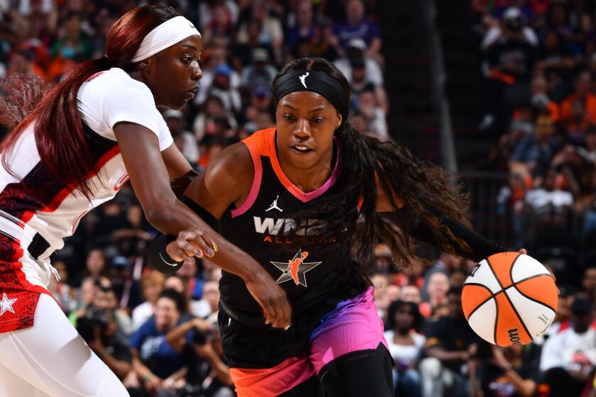 PHOENIX, AZ - JULY 20: Arike Ogunbowale #24 of Team WNBA dribbles the ball during the game.