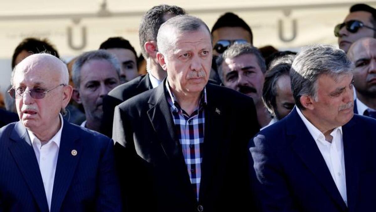 Turkish President Recep Tayyip Erdogan, center, along with the nation's current parliamentary speaker Ismail Kahraman, left, and former president Abdullah Gul.