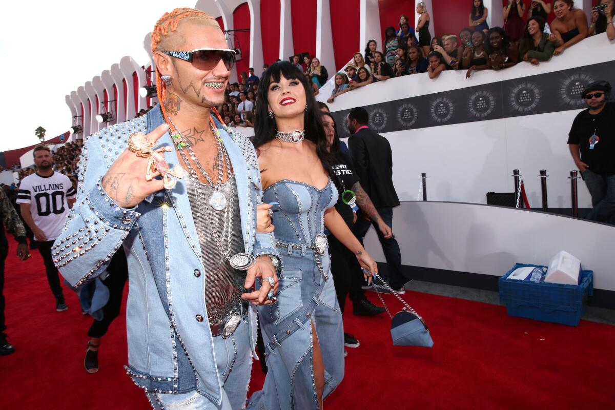 Rapper Riff Raff and Katy Perry arrive at the 2014 MTV Video Music Awards.
