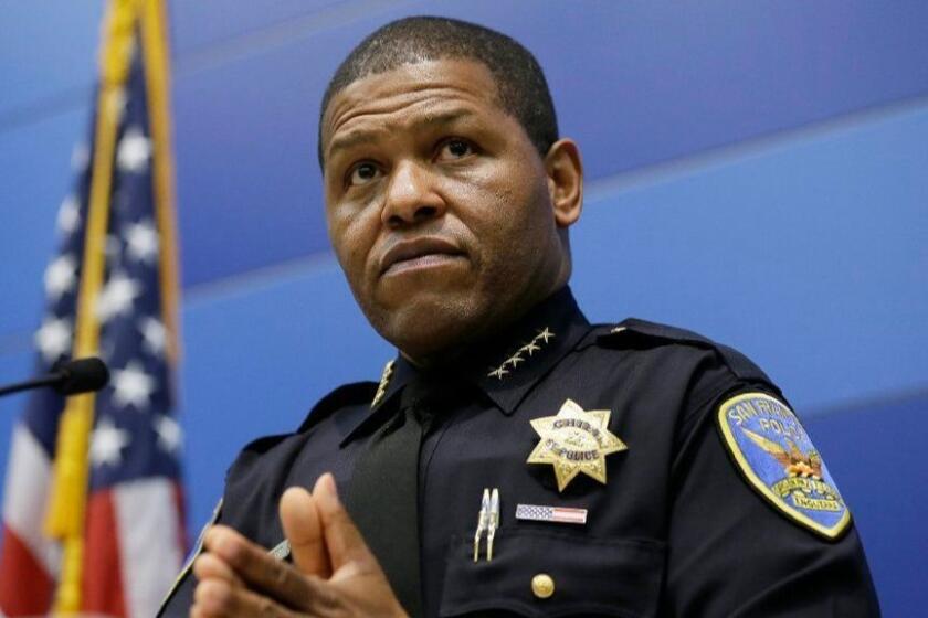 San Francisco Chief of Police William Scott listens to questions during a news conference Tuesday, May 21, 2019, in San Francisco. Police agreed Tuesday to return property seized from a San Francisco journalist in a raid, but the decision did little to ease tensions in the case, which has alarmed journalism advocates and put pressure on city leaders. Authorities have said the May 10 raids on freelancer Bryan Carmody's home and office were part of an investigation into what police called the illegal leak of a report on the death of former Public Defender Jeff Adachi, who died unexpectedly in February.(AP Photo/Eric Risberg)