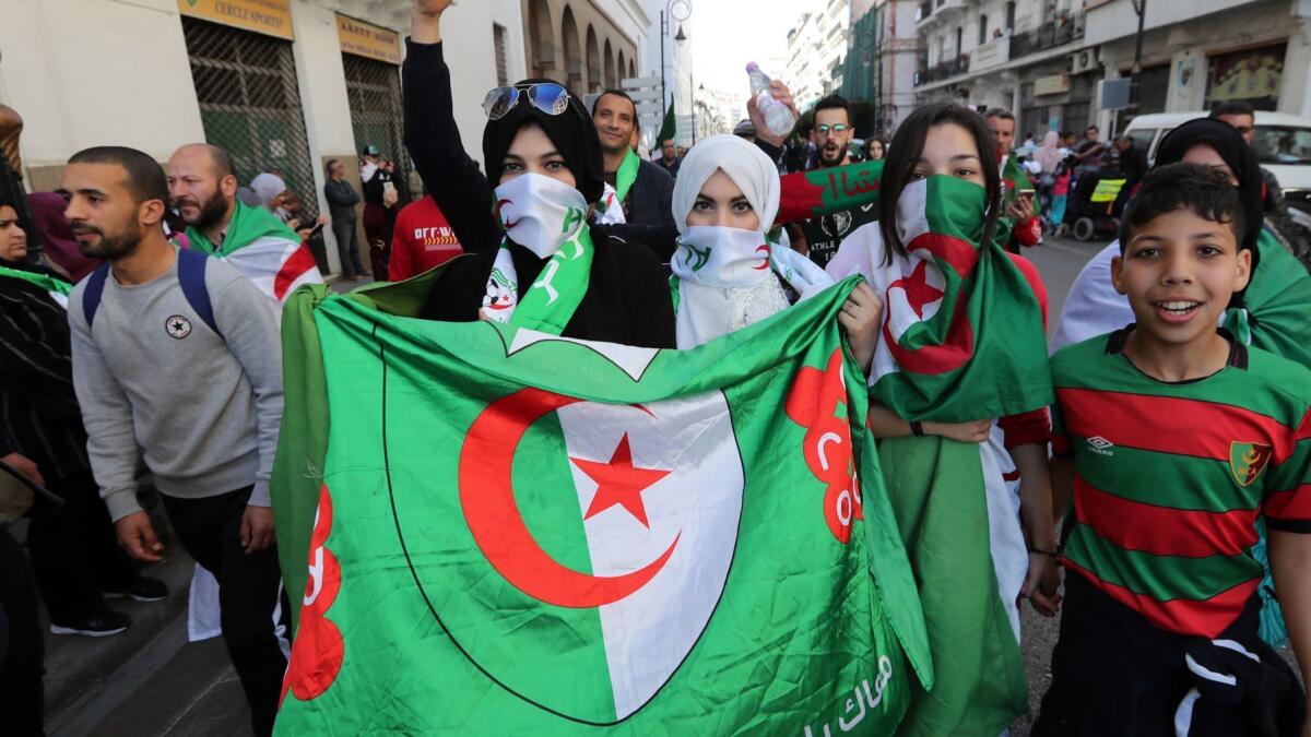 Algerians march in a protest against President Abdelaziz Bouteflika in Algiers on Friday.