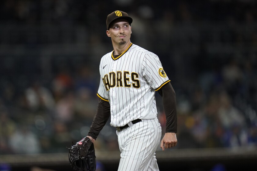 San Diego Padres starting pitcher Blake Snell walks toward the dugout after the top of the sixth inning of the team's baseball game against the New York Mets, Friday, June 4, 2021, in San Diego. (AP Photo/Gregory Bull)