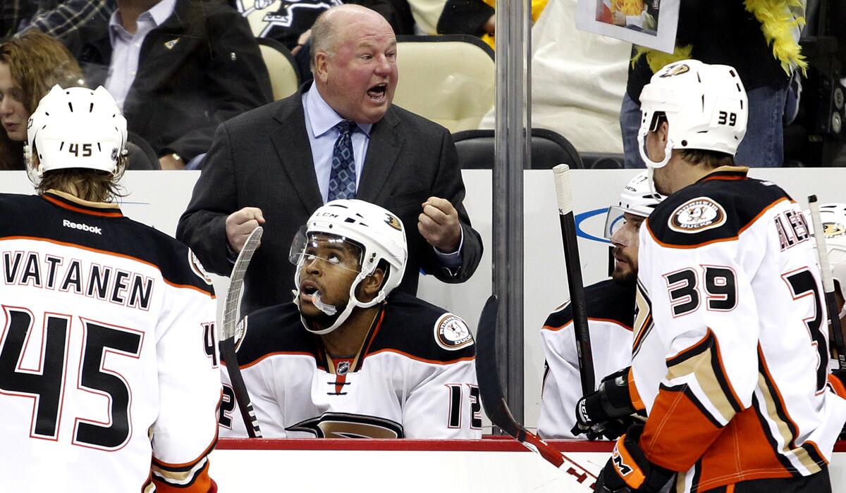 Ducks Coach Bruce Boudreau has some choice words for his players during their season-opening game in Pittsburgh.