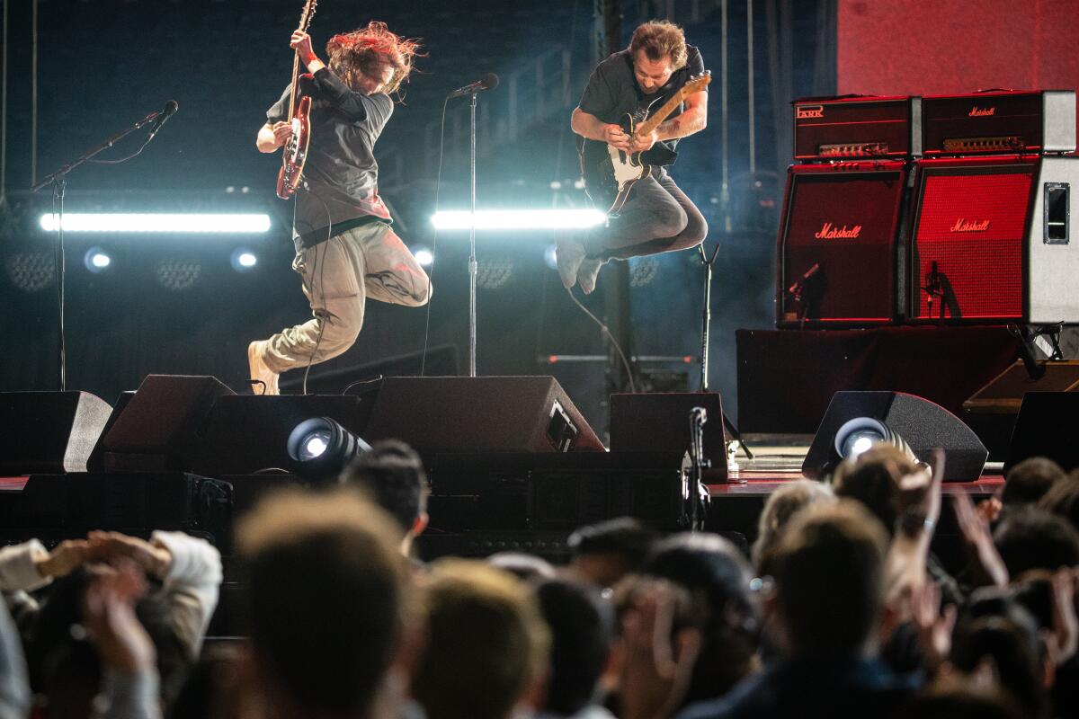 Josh Klinghoffer and Eddie Vedder perform at the Vax Live concert at SoFi Stadium in Inglewood.
