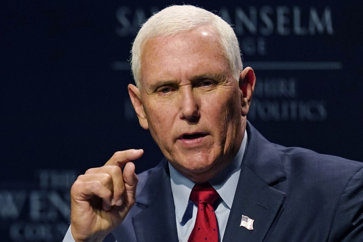 Mike Pence gestures while speaking