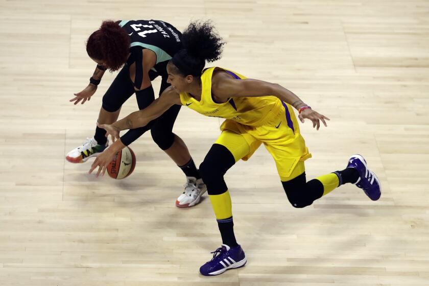 Los Angeles Sparks forward Candace Parker (3) steals the ball from New York Liberty center Amanda Zahui B. (17) during the first half of a WNBA basketball game Tuesday, Aug. 11, 2020, in Bradenton, Fla. (AP Photo/Chris O'Meara)