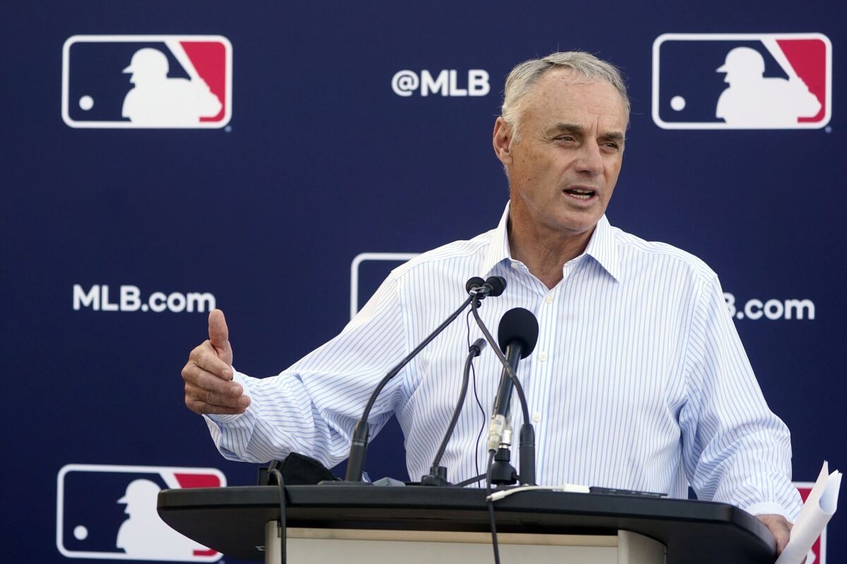 Major League Baseball Commissioner Rob Manfred speaks during a news conference Tuesday.