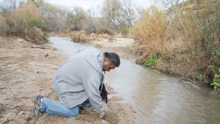 Mike Stevens shows how he used to filter water to drink near where tribal members say an herbicide similar to Agent Orange was tested during the 1960s on the San Carlos Apache Reservation.