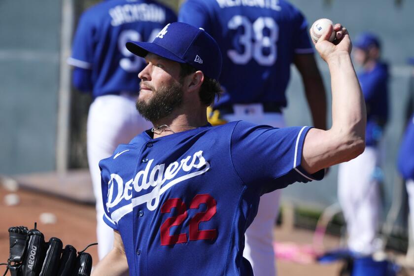 Los Angeles Dodgers starting pitcher Clayton Kershaw throws during the first day of spring training baseball workouts for Dodgers pitchers and catchers in Phoenix, Thursday, Feb. 16, 2023. (AP Photo/Ross D. Franklin)