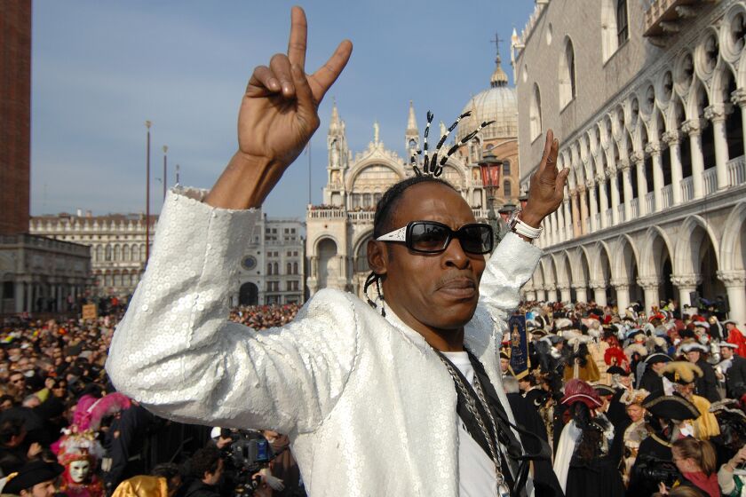 U.S. rapper Coolio poses after he performed the traditional "Flight of the Angel" hanging from a cable tied from the bell tower to a St. Mark's square filled to capacity, in Venice, northern Italy, Sunday, Jan.27, 2008. During this centuries-old rite which marks the official beginning of Venice's Carnival celebrations, Coolio scattered paper confetti on spectators below. The week-long carnival festivities in the historical lagoon city attracts people from around the world. (AP Photo/Luigi Costantini)