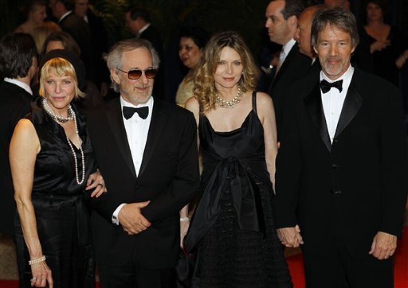 Kate Capshaw, left, Director Steven Spielberg, second from left, Michelle Pfeiffer, second from right, and David E. Kelley attend the 2010 White House Correspondents' Dinner at the Washington Hilton Saturday, May 1, 2010, in Washington. (AP Photo/Luis M. Alvarez)