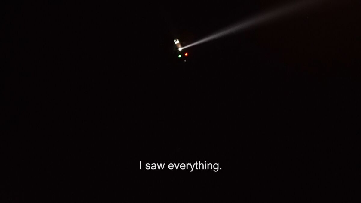 A still from a video work by Guadalupe Rosales shows a helicopter in a night sky