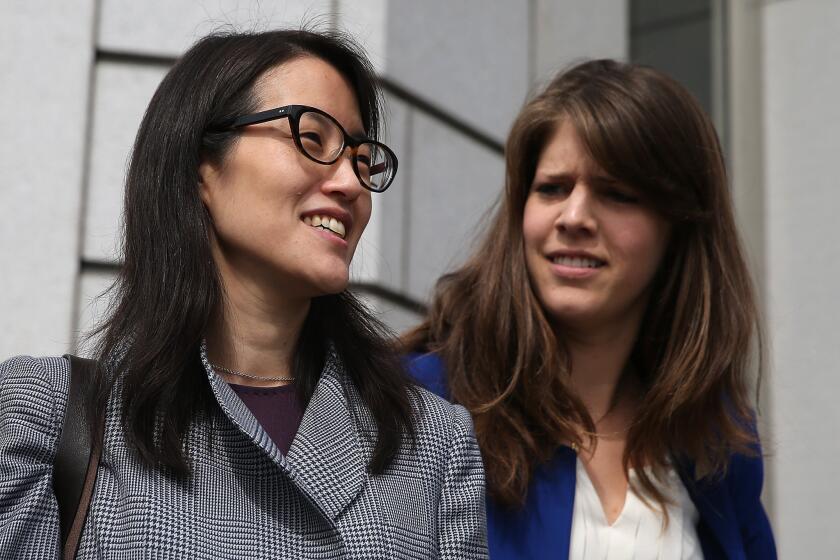 Ellen Pao, left, leaves the California Superior Court Civic Center Courthouse in San Francisco during a lunch break from her trial on March 10.
