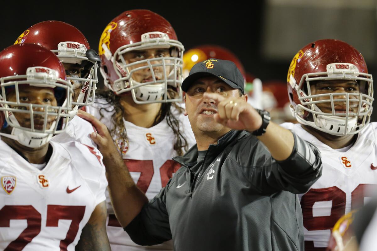 USC Coach Steve Sarkisian instructs the Trojans against Arizona on Oct. 11 in Tucson, Ariz.